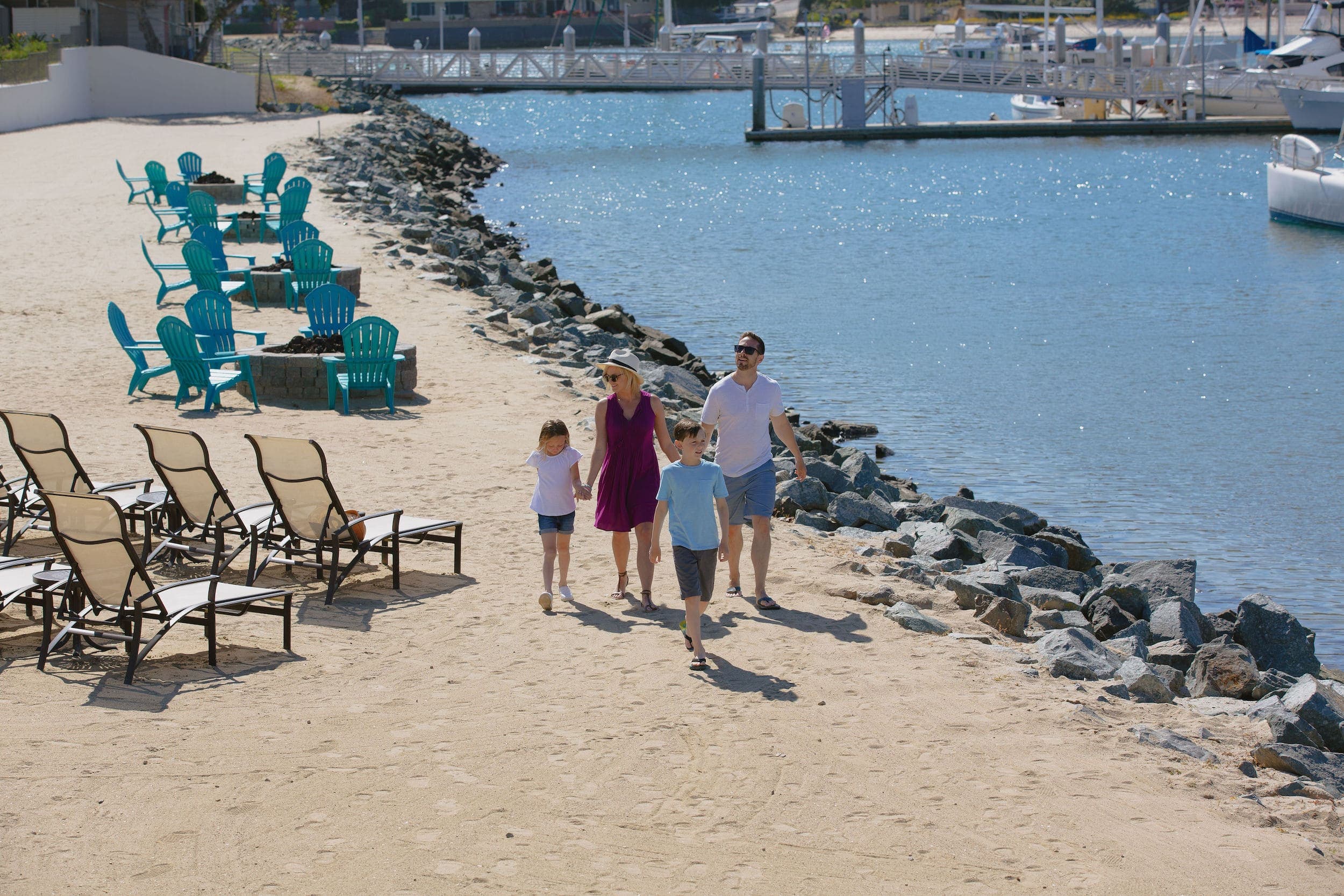 A family beach walk outside Kona Kai