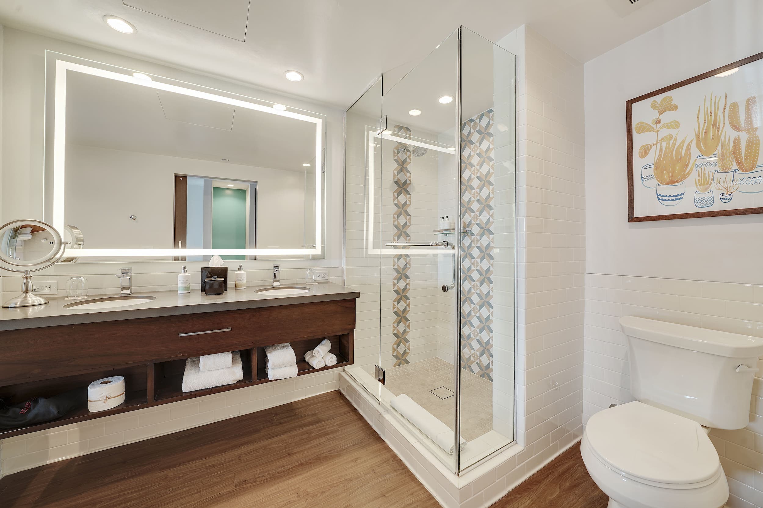 A large vanity with 2 sinks and a walking shower in a room at Kona Kai