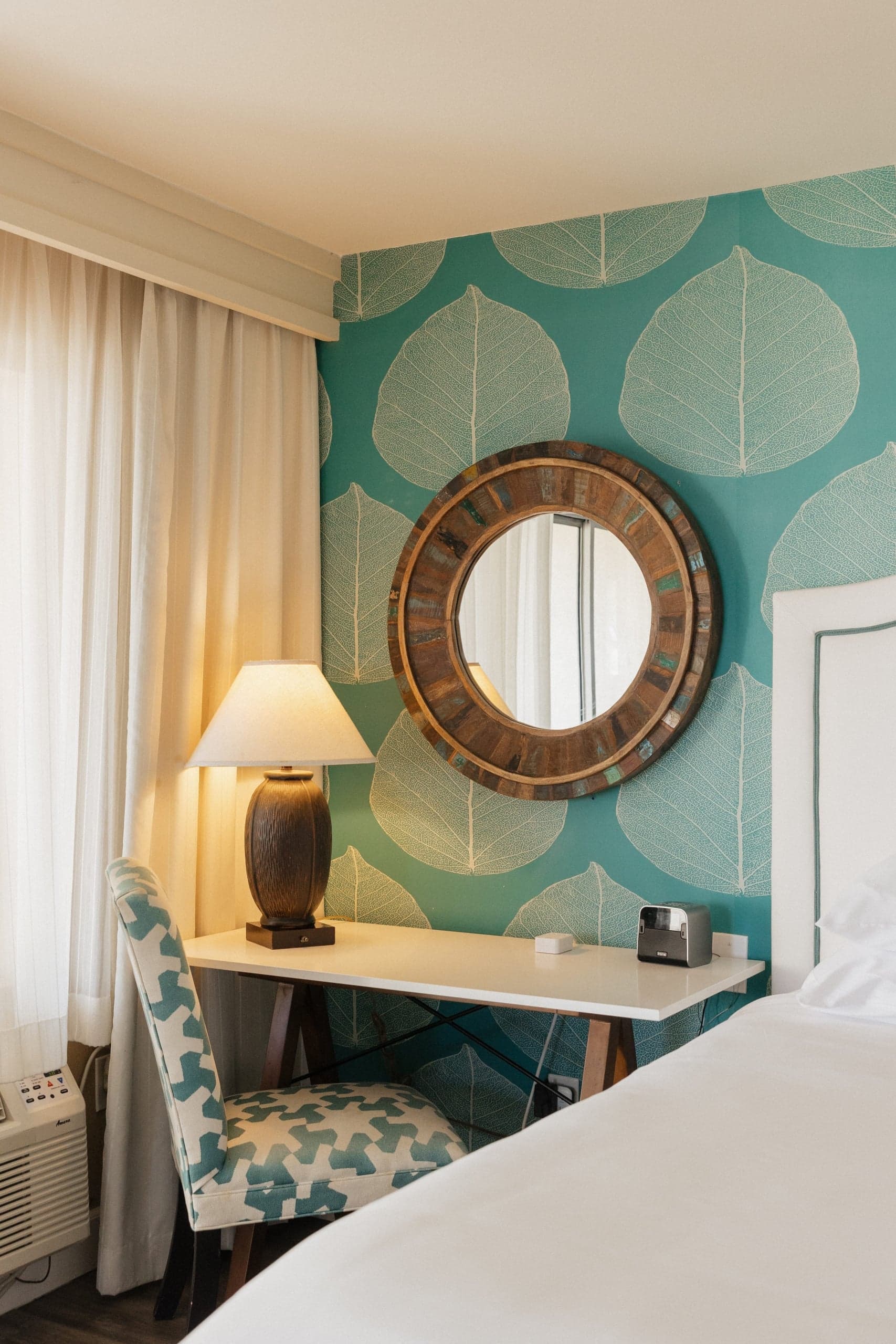 A desk and bed at Kona Kai