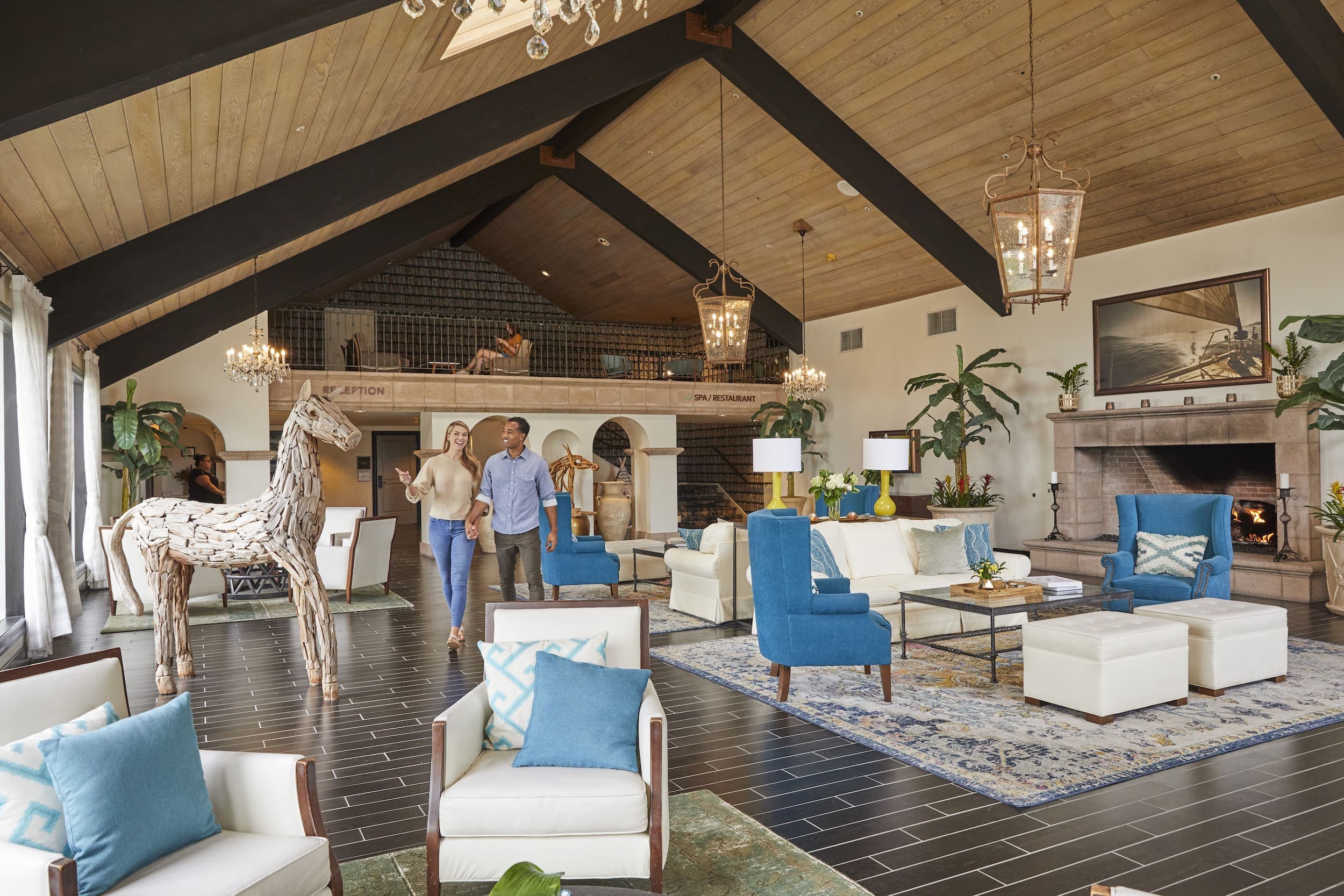 Two people walking through Kona Kai's lobby