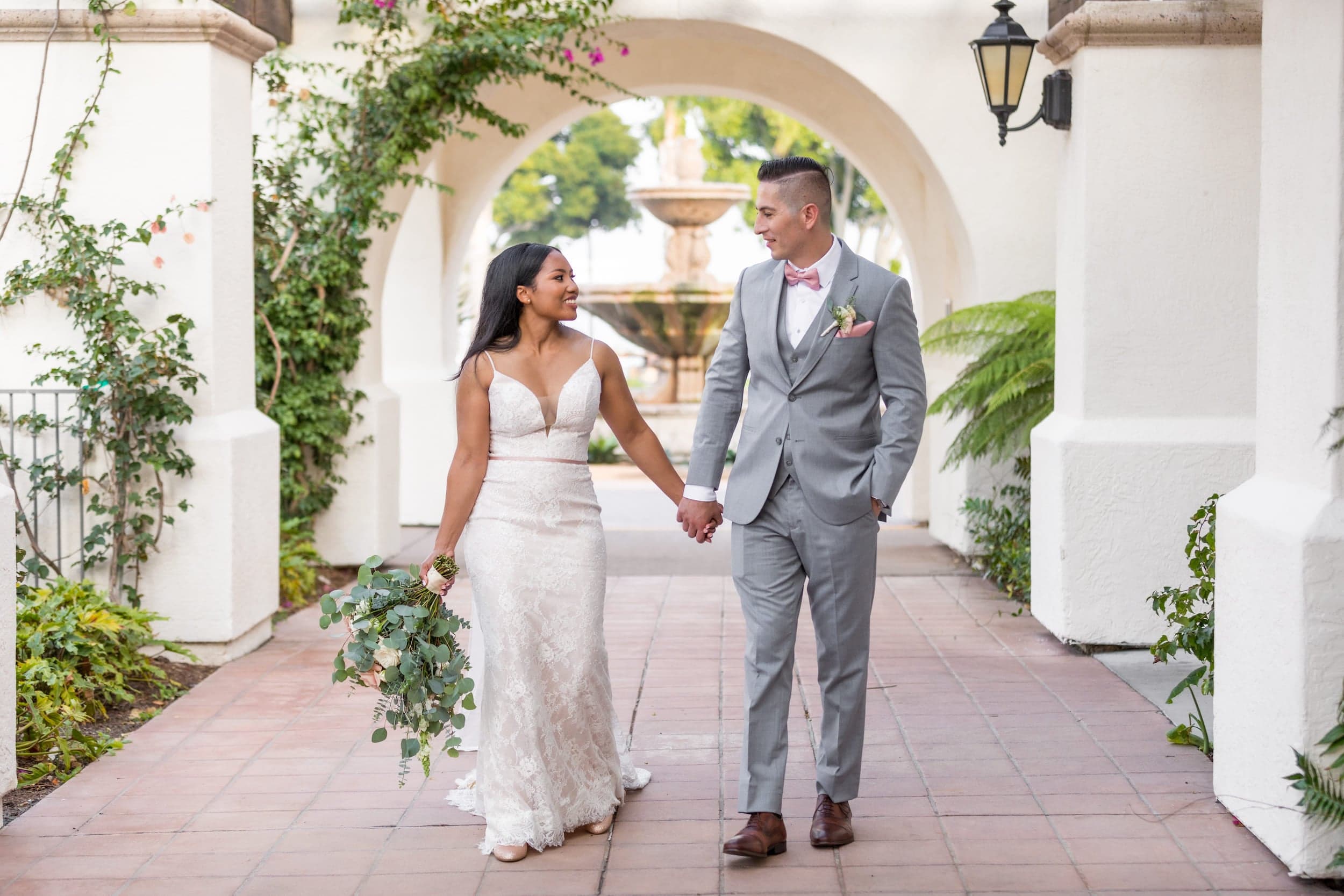 A newly wed couple holding hands