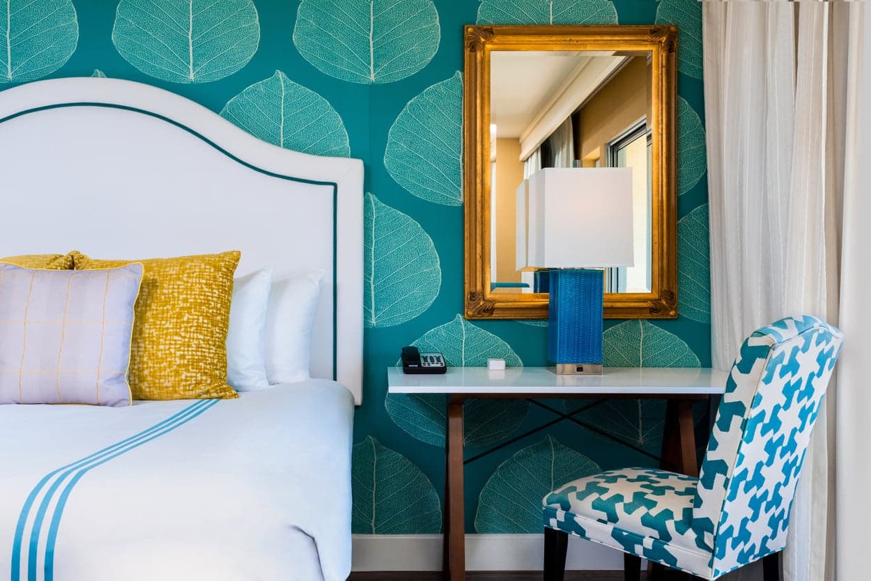 A king bed and an ADA approved desk area at Kona Kai