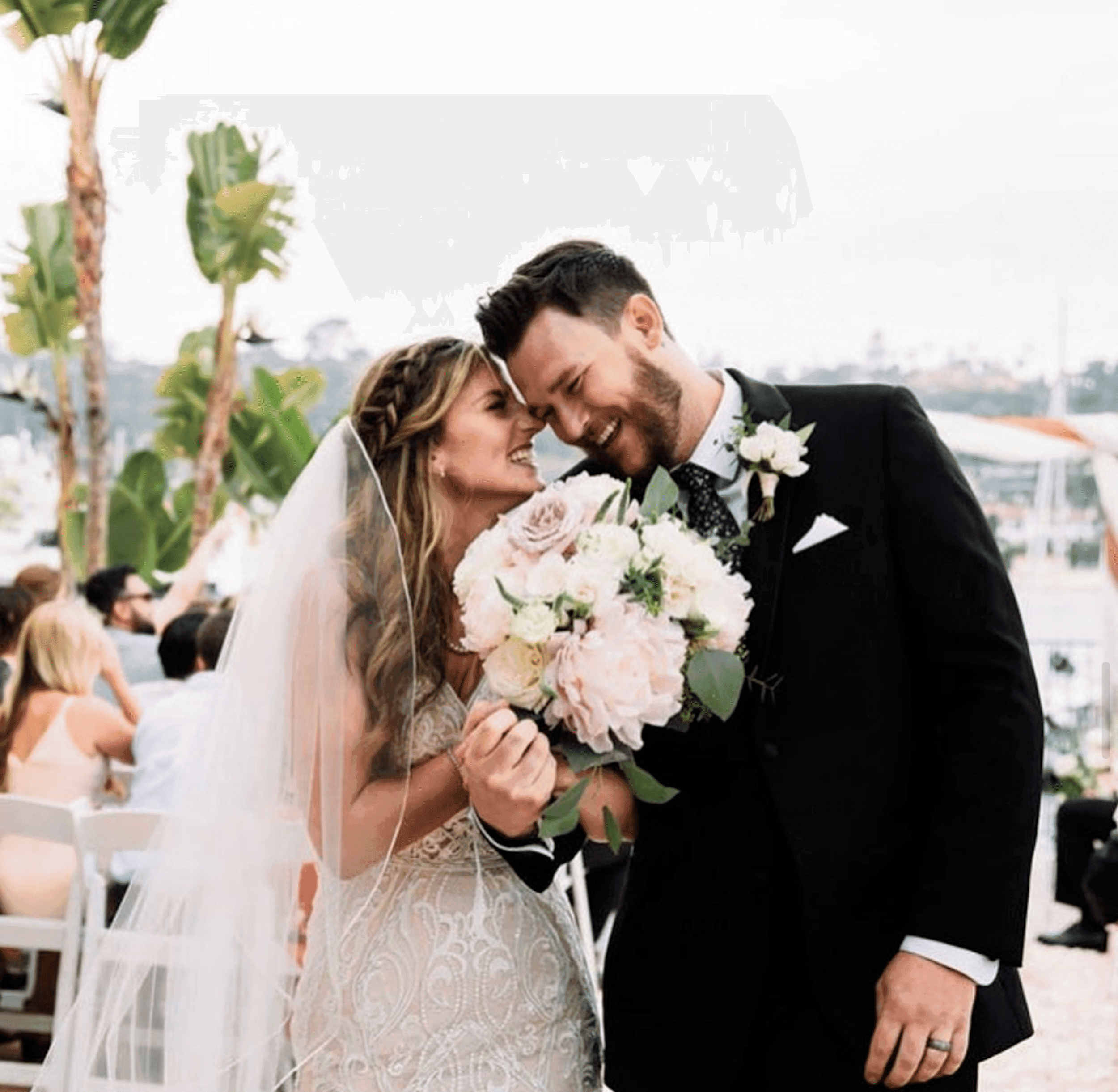 A newly married couple laughing