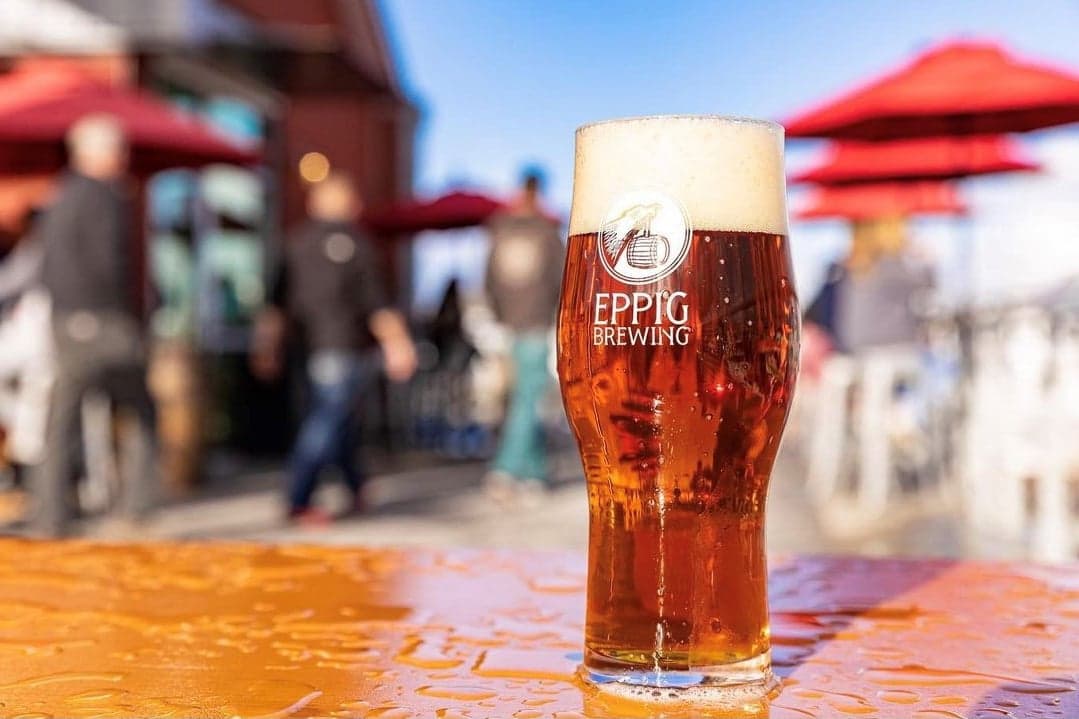 A glass of Epping beer on a patio table