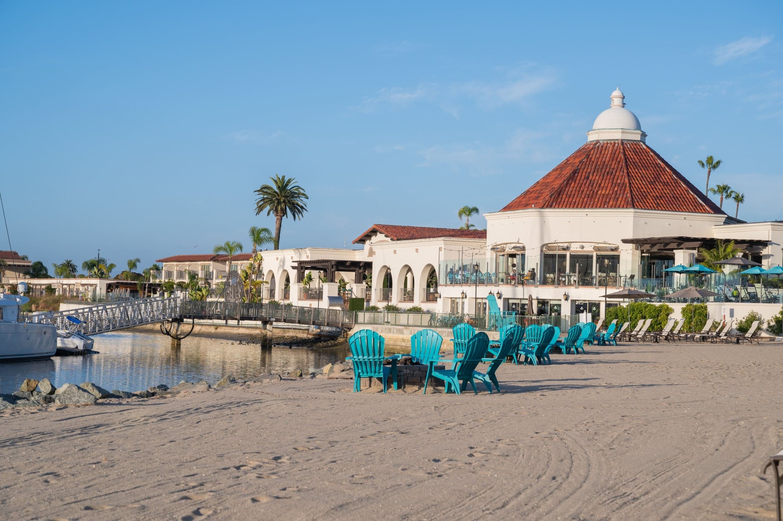 The beach with a bunch of beach chairs outside Kona Kai resort