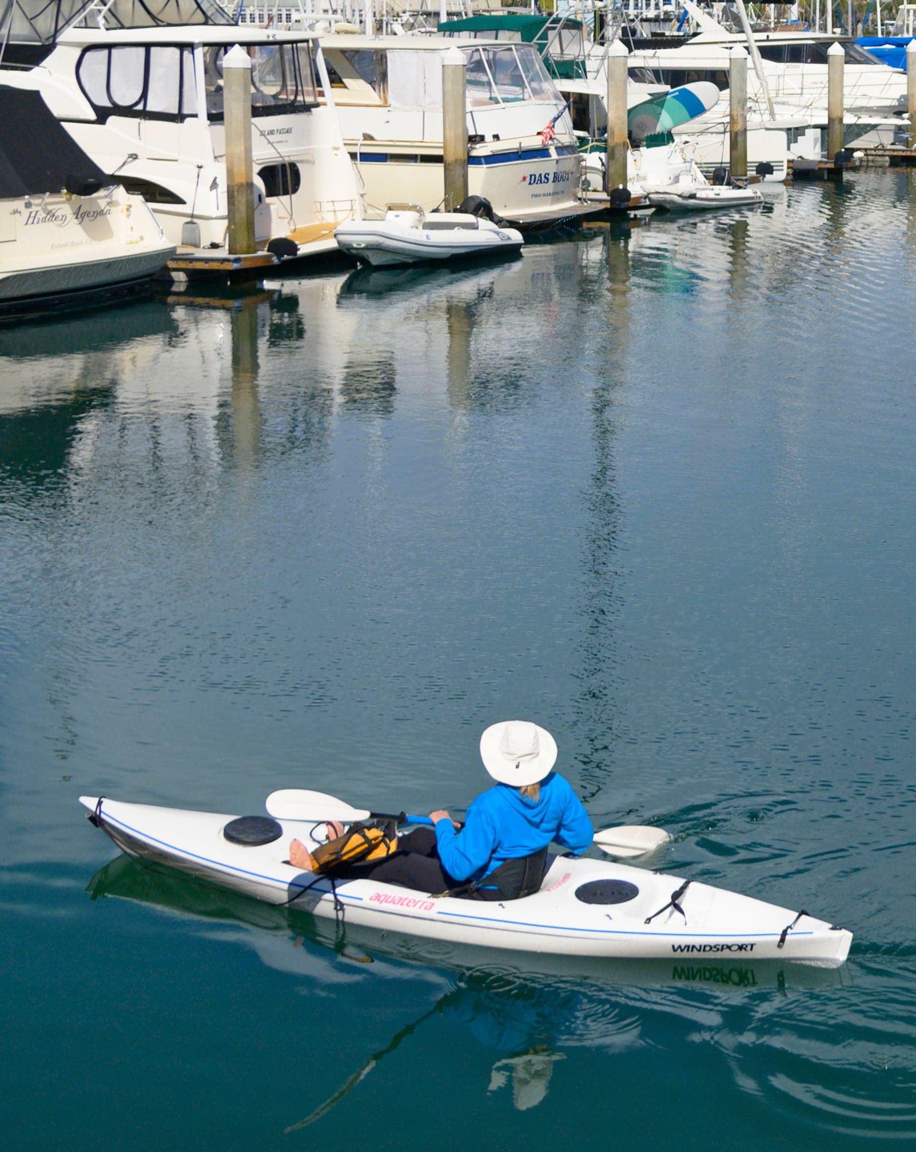 A person in a kayak close to Kona Kai