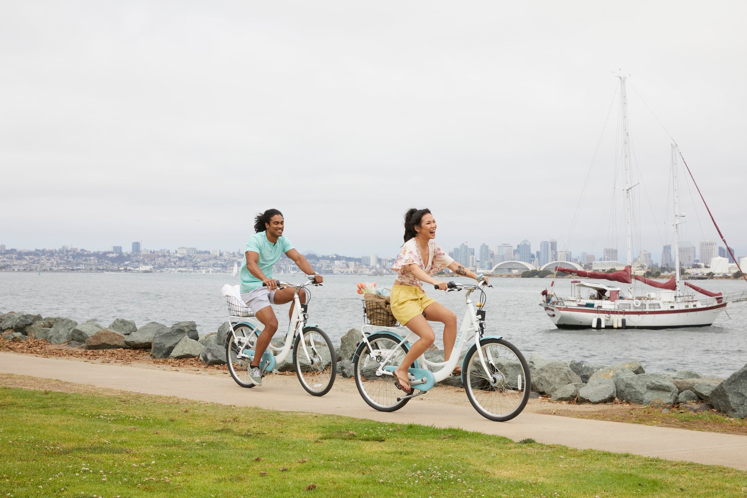 A couple biking on the boardwalk near Kona Kai Resort