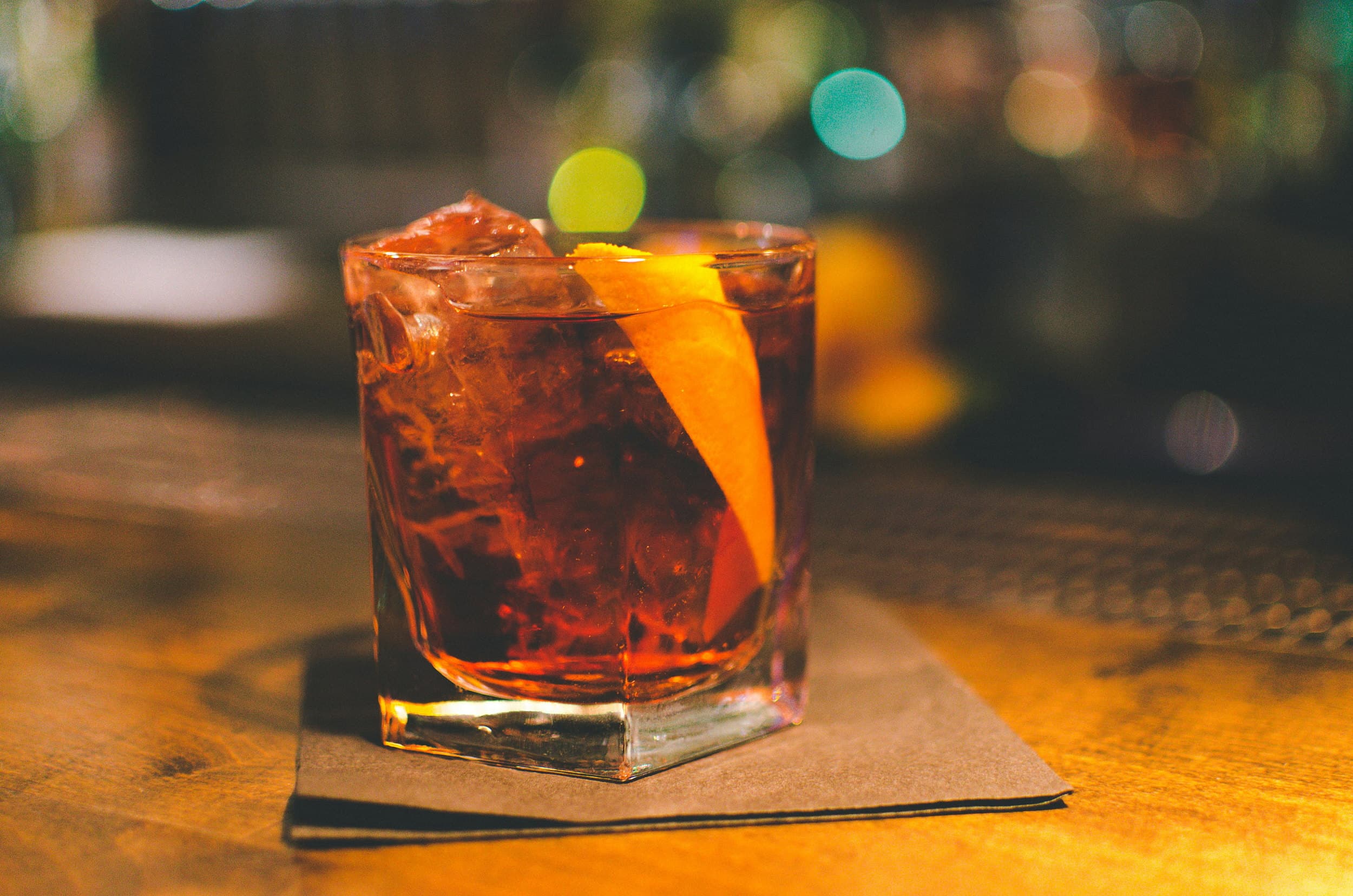 Negroni cocktail with orange peel garnish served at the Kona Kai Resort & Spa bar on Shelter Island in San Diego