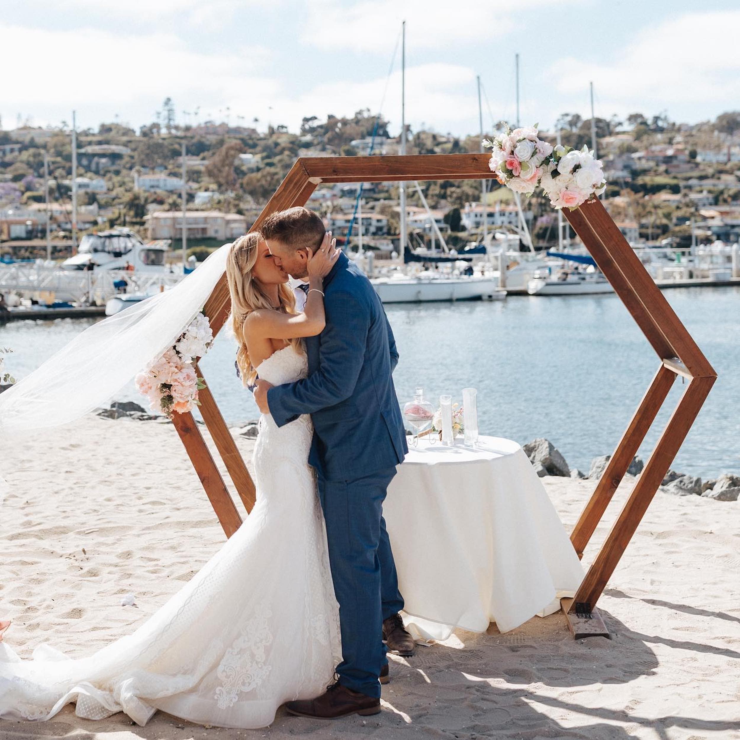 A newly wed couple kissing