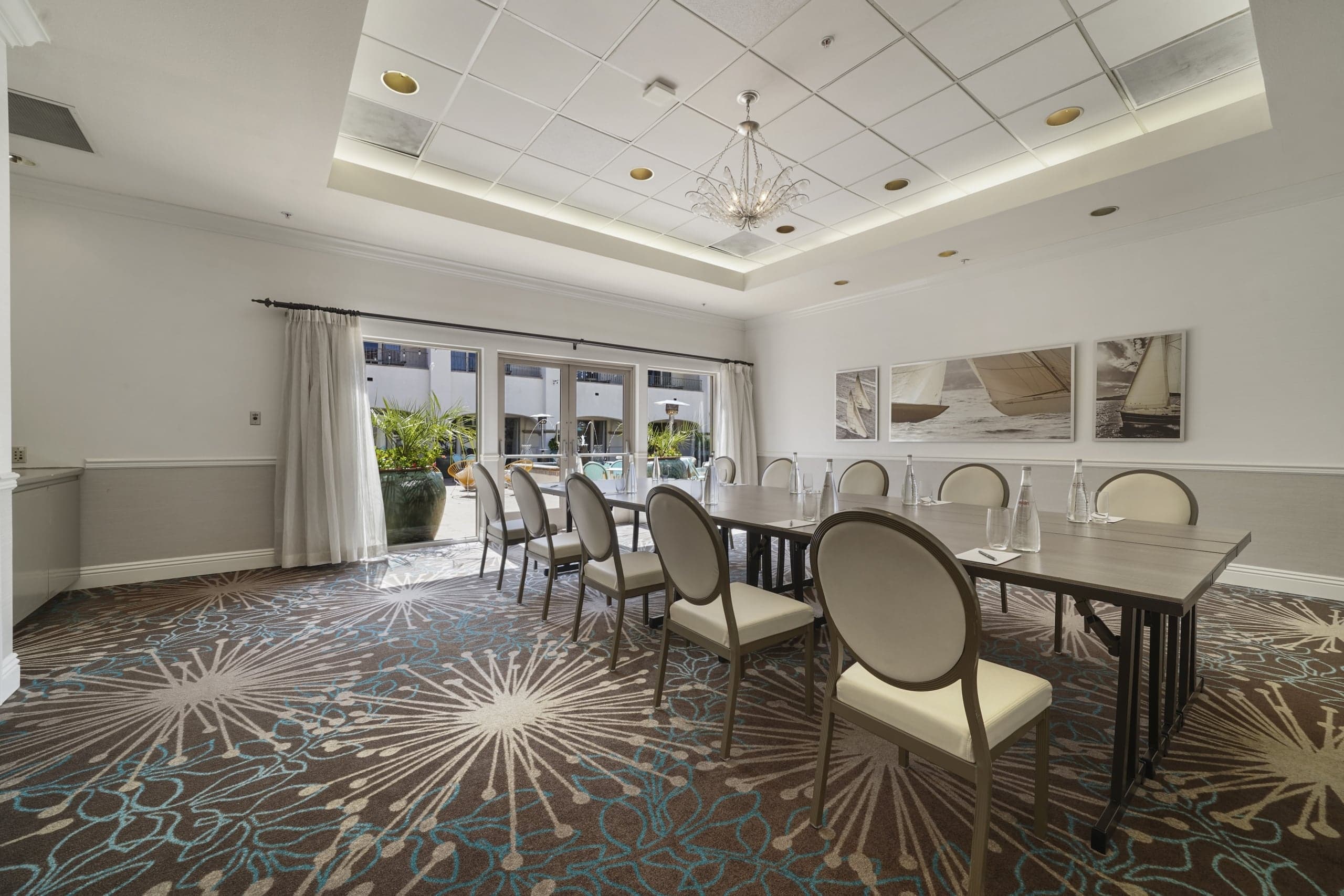 The Del Mar meeting room, set up with a long conference table surrounded by chairs