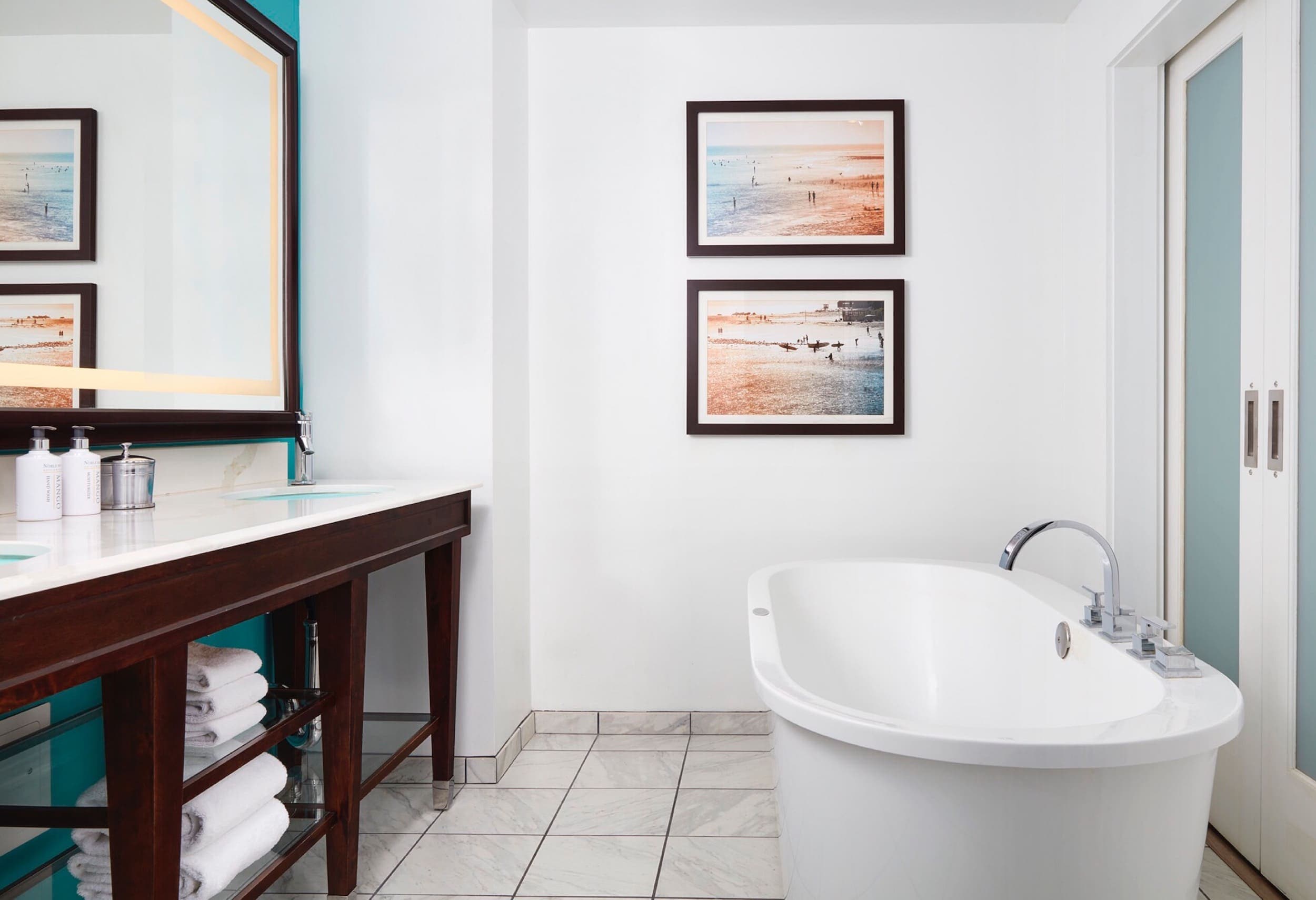A double vanity and a soaker tub in a suite at Kona Kai
