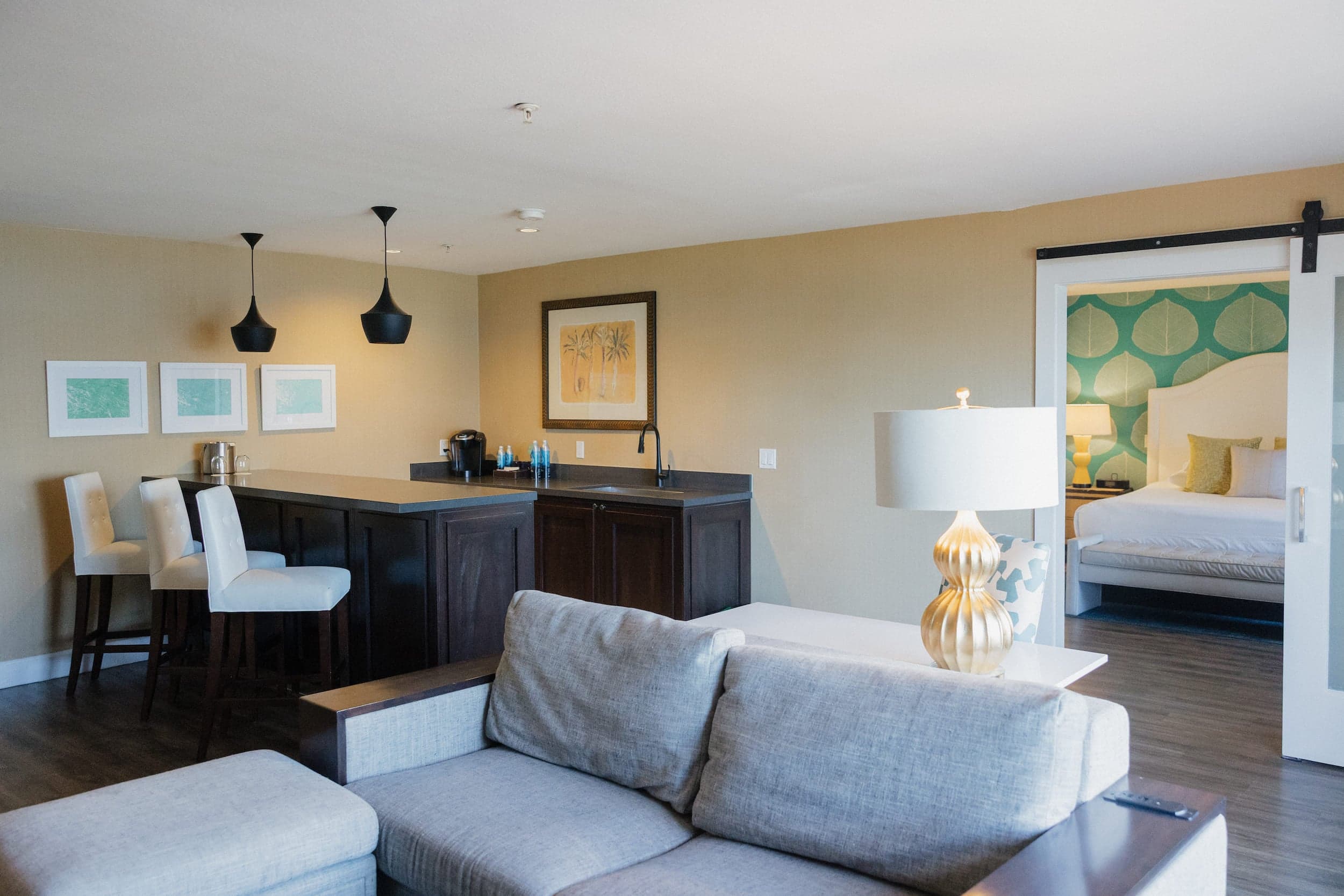 An eat-in kitchen bar top and a living space on a One Bedroom Suite at Kona Kai
