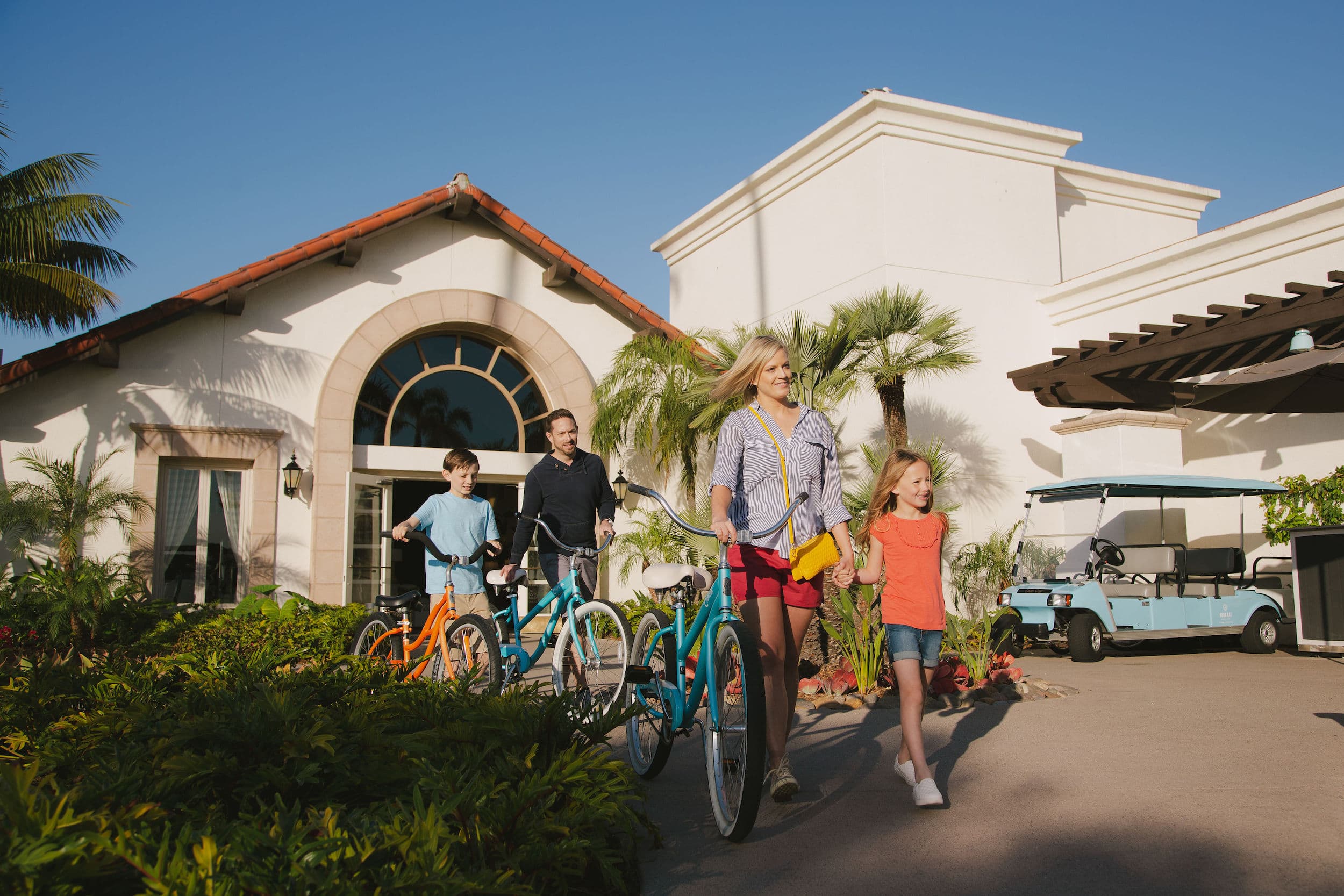 A family leaving Kona Kai for a bike ride