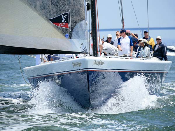 Stars and Stripes sailboat in the water.