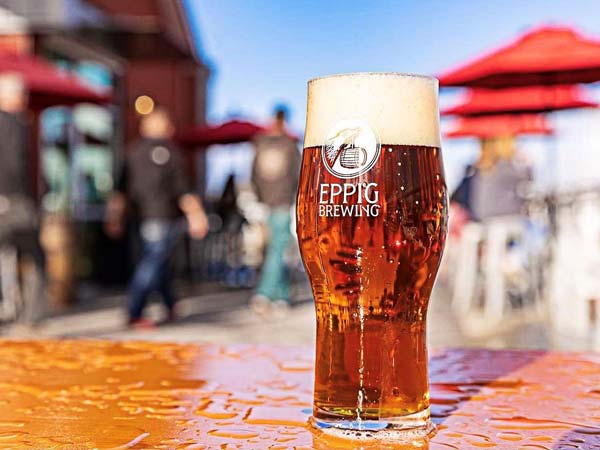 Eppig Brewing Beer On A Table Outside.
