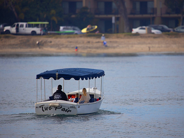 Couple Riding On A Duffy Boat.