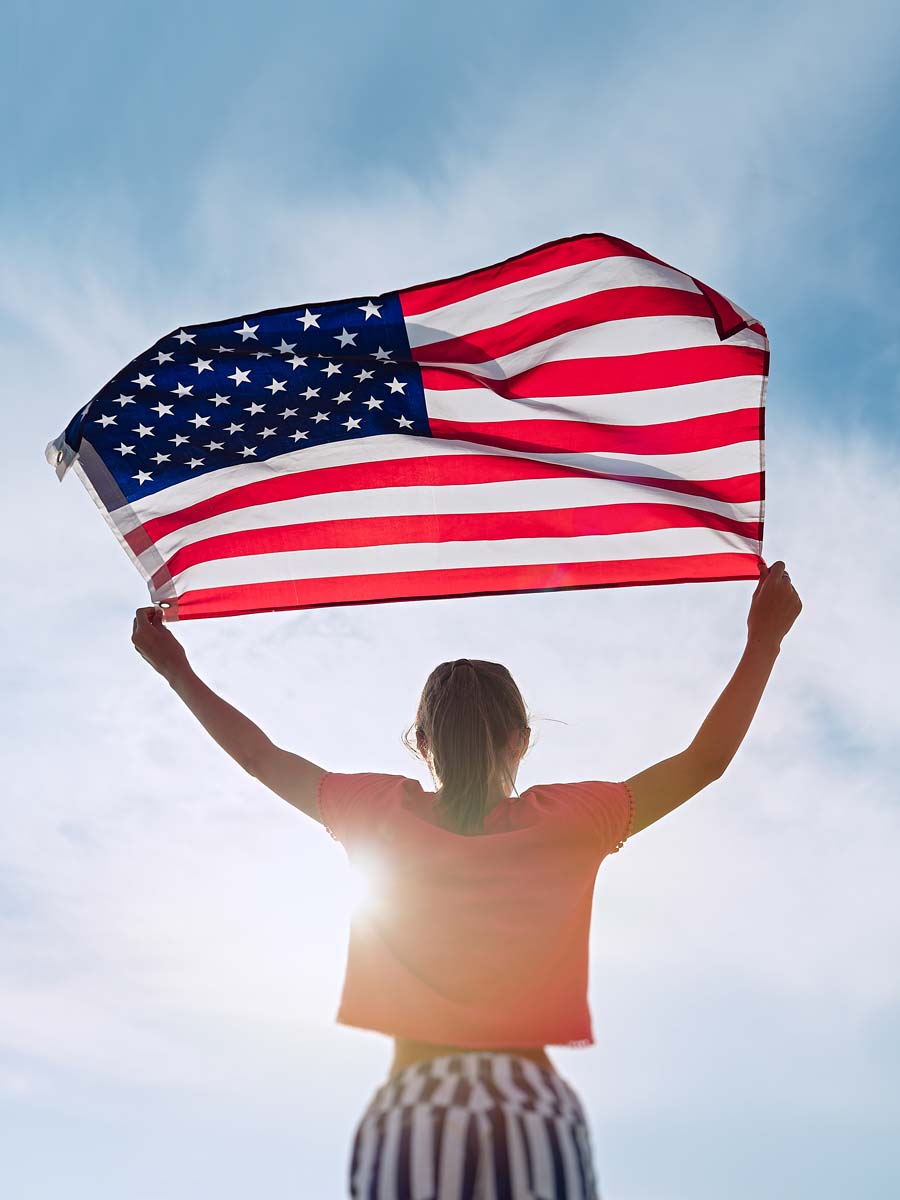 Person Holding An American Flag.