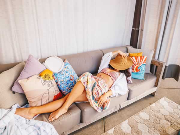 Lady relaxing on sofa in spa