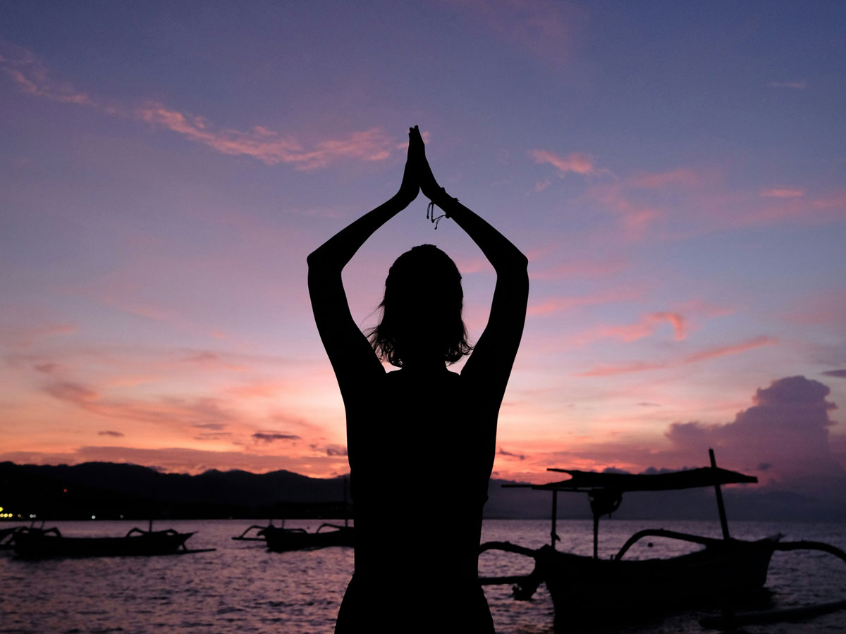 Girl Doing Yoga By The Water